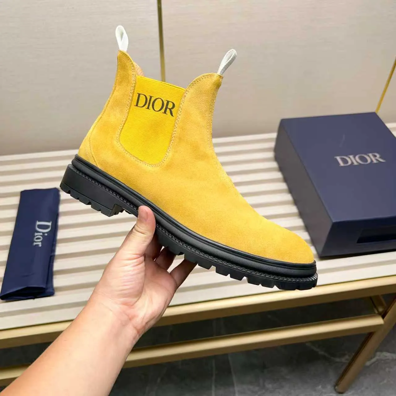 Men's Shoes 💰480 Dior A practical choice that combines protection with classic style. Made from durable Rugged Calf leather, it's tumbled and hand-finished to create a soft suede feel with a rich texture. Elastic side panels and subtle cutouts are inspired by the classic Chelsea boot. Leather upper and lining with Kummel tabs at front and rear, rubber outsole